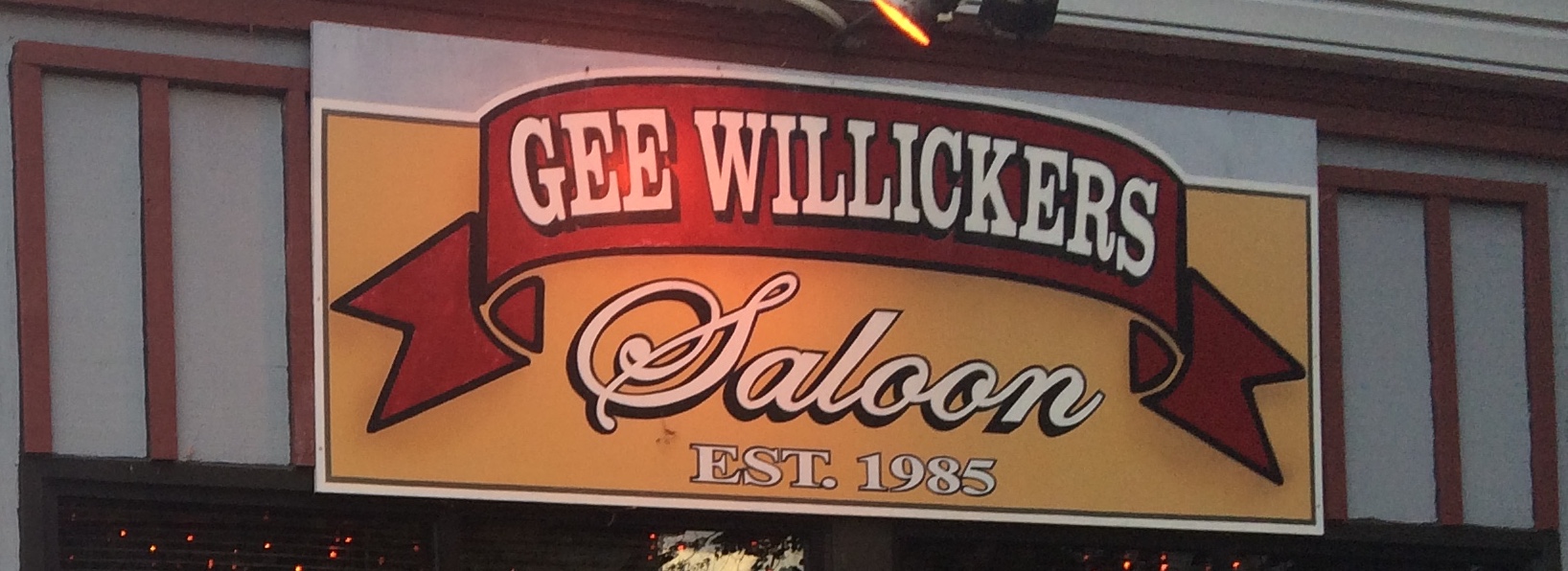 Picture of a sign reading Gee Willickers Saloon Est. 1985